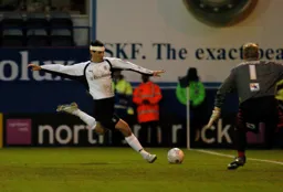A bandaged Matthew Spring takes on the Brentford keeper