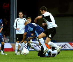 Chris Coyne battles for the ball