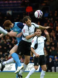 Richard Jackson wins a header