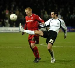 Matthew Spring stretches a leg out to win the ball
