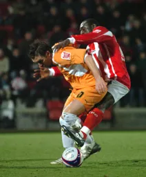 Darren Currie tussles for the ball