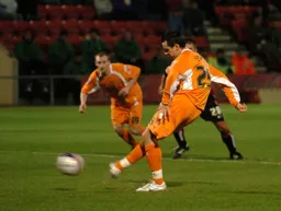 Matthew Spring strikes the ball