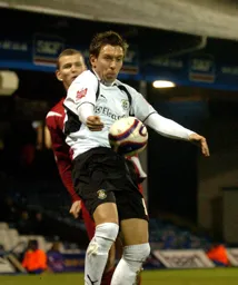 Darren Currie shields the ball