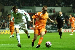 Drew Talbot up against a Swansea defender