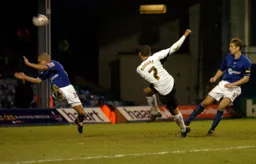 Dean Morgan shoots at goal