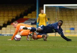 Chris Perry goes to ground to win the ball