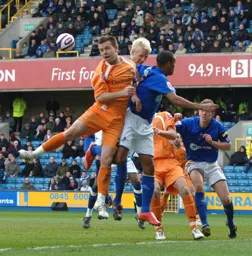 Keith Kean heads away