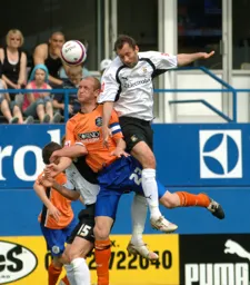 Don Hutchison wins a towering header
