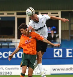 Sam Parkin gets his head to the ball
