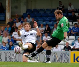 Rossi Jarvis closes down the Gills goalkeeper