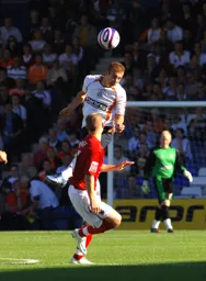 Jake Howells heads the ball on