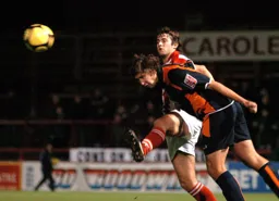 Ian Roper with a typically robust defensive header