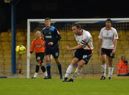 Kevin Watson plays the ball downfield