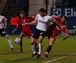 Chris Martin holds off a Bournemouth defender