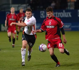 Kevin Gallen challenges for a loose ball