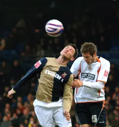 Rossi Jarvis heads the ball on