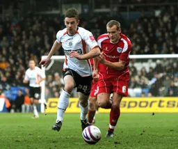 Tom Craddock in a chase for the ball