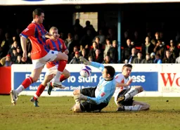 Daggers goalkeeper Tony Roberts charges out of his goal