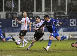 Kevin Gallen ploughs through the mud