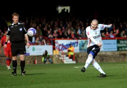 Kevin Nicholls sends in a piledriver