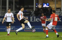 Tom Craddock controls the ball on the edge of the Mariners area
