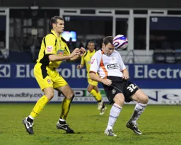 Kevin Gallen cushions a header