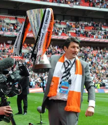 Manager Mick Harford with the trophy