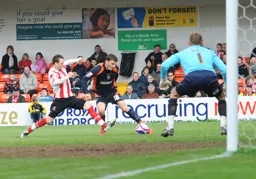 Chris Martin gets the ball across