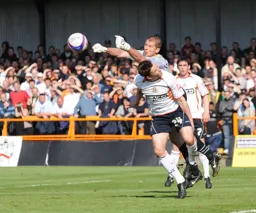 Tom Craddock puts pressure on the Barnet goalkeeper