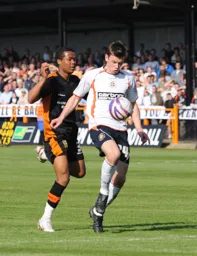 Tom Craddock shields the ball