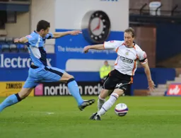 David Livermoregoes round a Wycombe defender