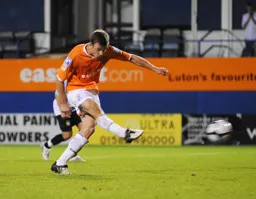Tom Craddock scores Town`s fourth goal from the penalty spot