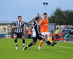 Fred Murray goes in for a fifty fifty ball