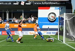Its in the net. Adam Newton`s attempted cross ended in a goal