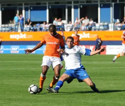 Adam Newton gets away from a despearing challenge