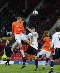 Asa Hall wins an attacking header