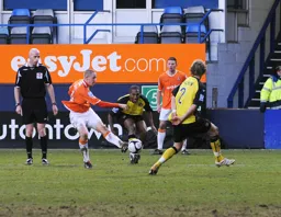 Asa Hall tries a shot from the edge of the penalty area