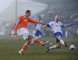 Liam Hatch shoots before Paul Jones can get a block in