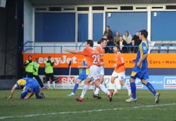 Tom Craddock turns away after scoring Town`s only goal. Kevin Gallen seems to be pointing something out to somebody