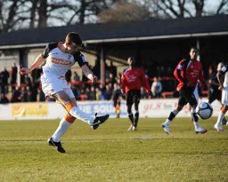 Tom Craddock hammers in the third goal