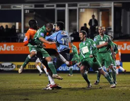 Danny Ireland grabs the ball under pressure from Claude Gnakpa