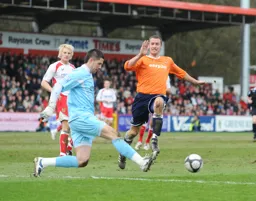 Chris Day gets his foot in to deny Liam Hatch