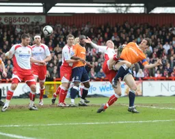 George Pilkington flicks the ball on towards goal