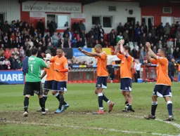 Town players celebrate after the final whistle