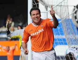 Kevin Gallen is all smiles after completing his hat-trick