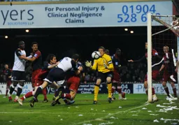 George Pilkington goes close with a diving header