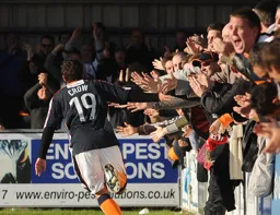 Danny Crow celebrates his return to goalscoring form with the Luton travelling faithful