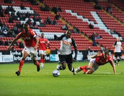 Amari Morgan-Smith is brought down for a penalty