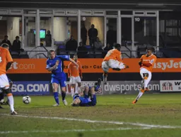 Matthew Barnes-Homer scores the Luton second but Claude Gnapka deserves credit for the evasive action he took