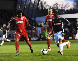 Adam Newton looks to take on the Crawley defence